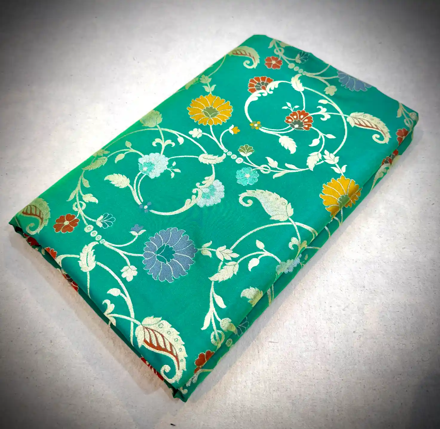 Teal Green Katan Silk Saree with Multicolor Floral Vine Weaving